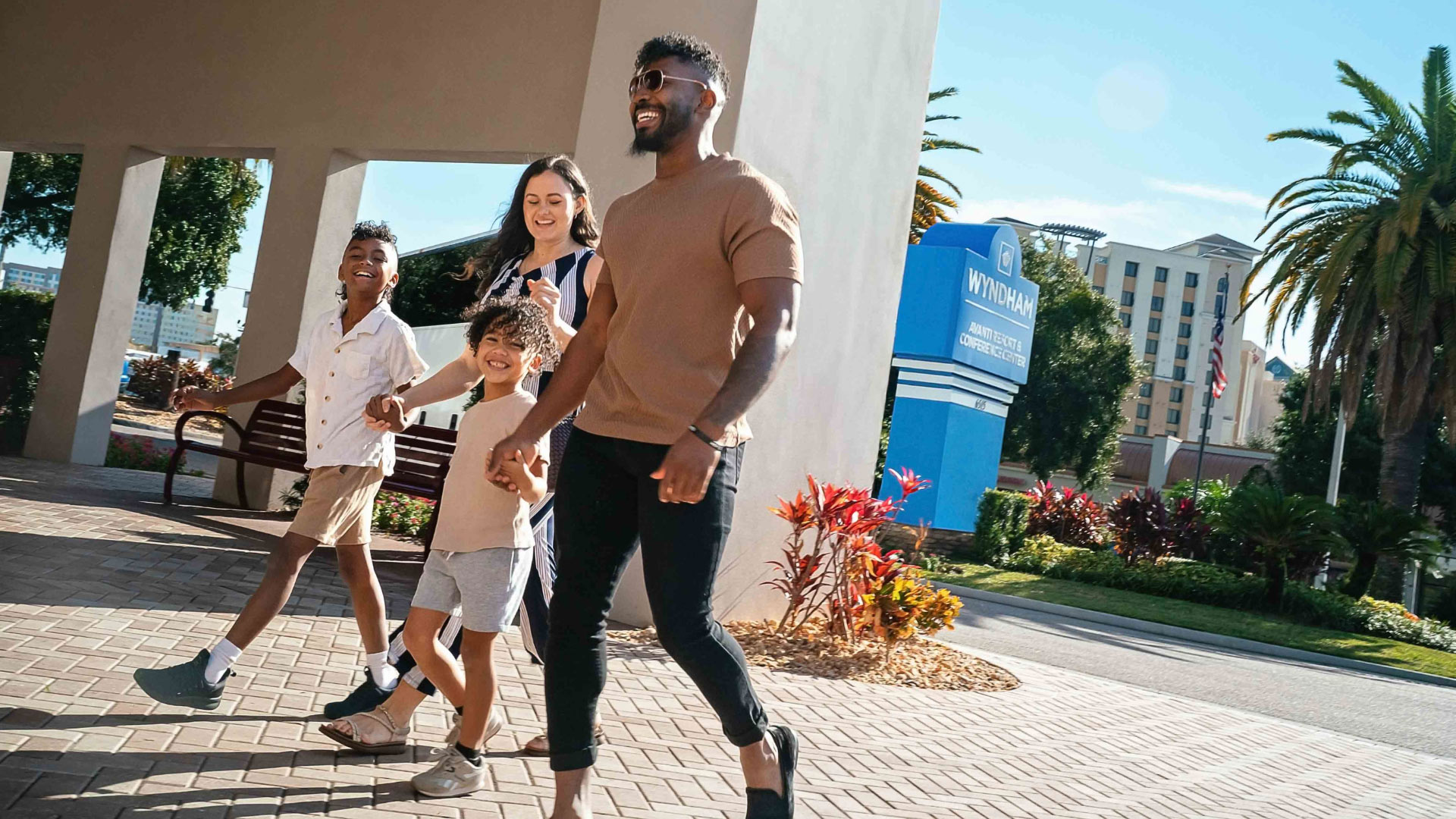 mom, dad and 2 sons walking