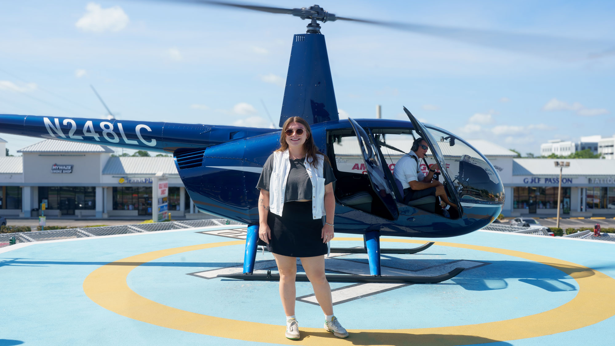 woman standing by helicopter